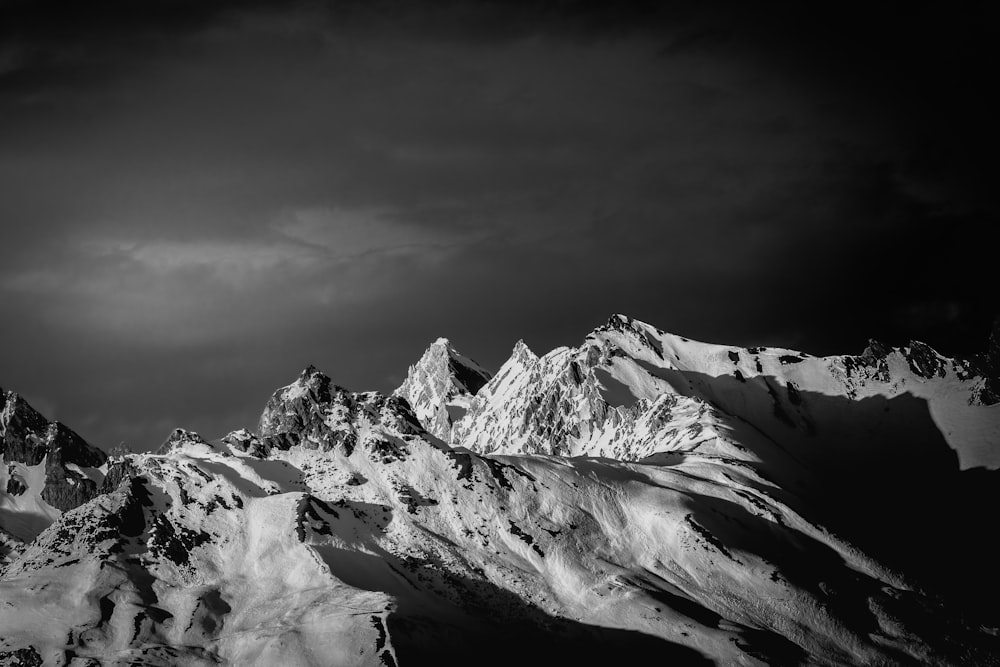 a black and white photo of a mountain range