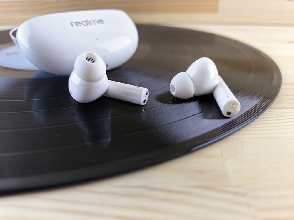 a pair of headphones sitting on top of a record