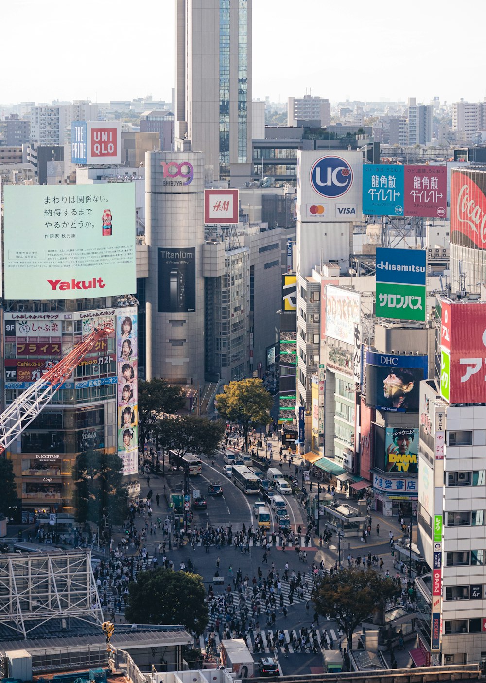 a busy city street filled with lots of tall buildings