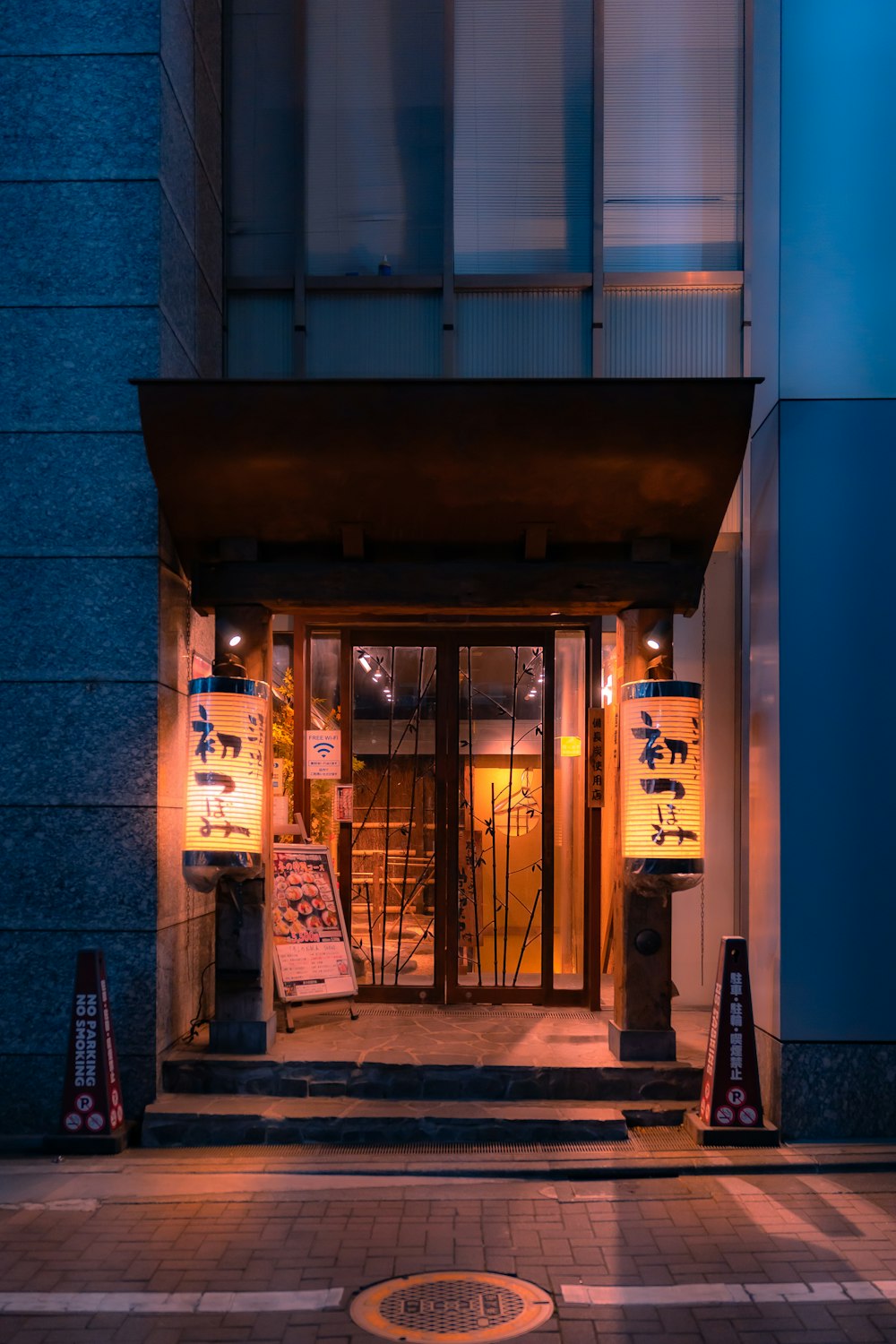 an entrance to a building at night time