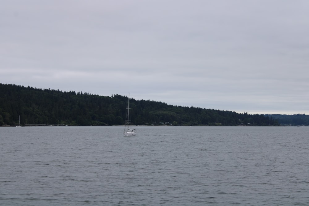 a sailboat in the middle of a large body of water