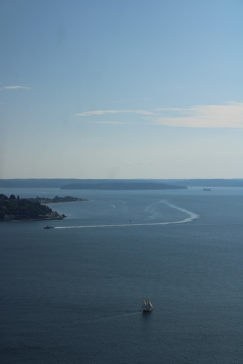 a boat traveling across a large body of water