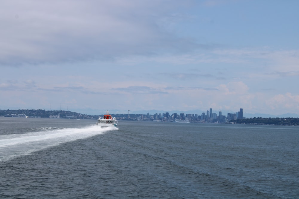 a boat traveling across a large body of water