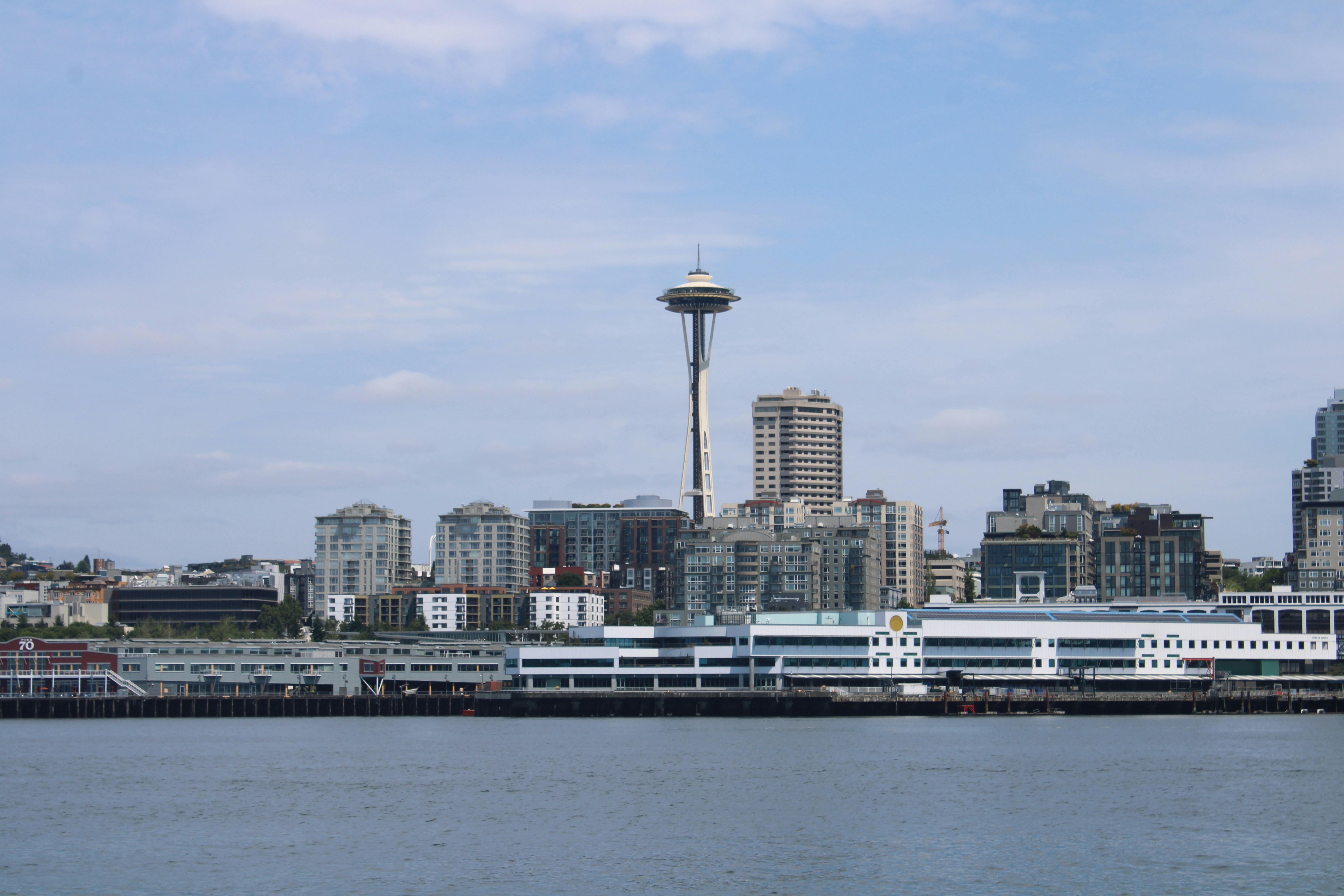 a large body of water with a city in the background