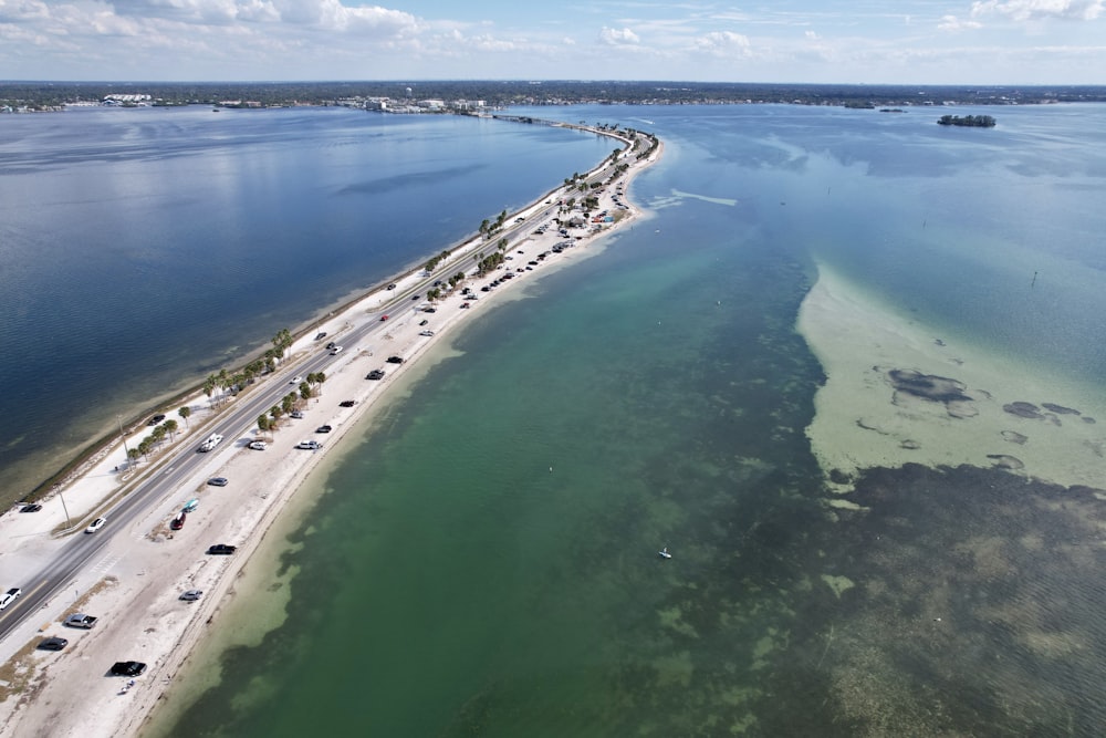 an aerial view of a beach and a highway