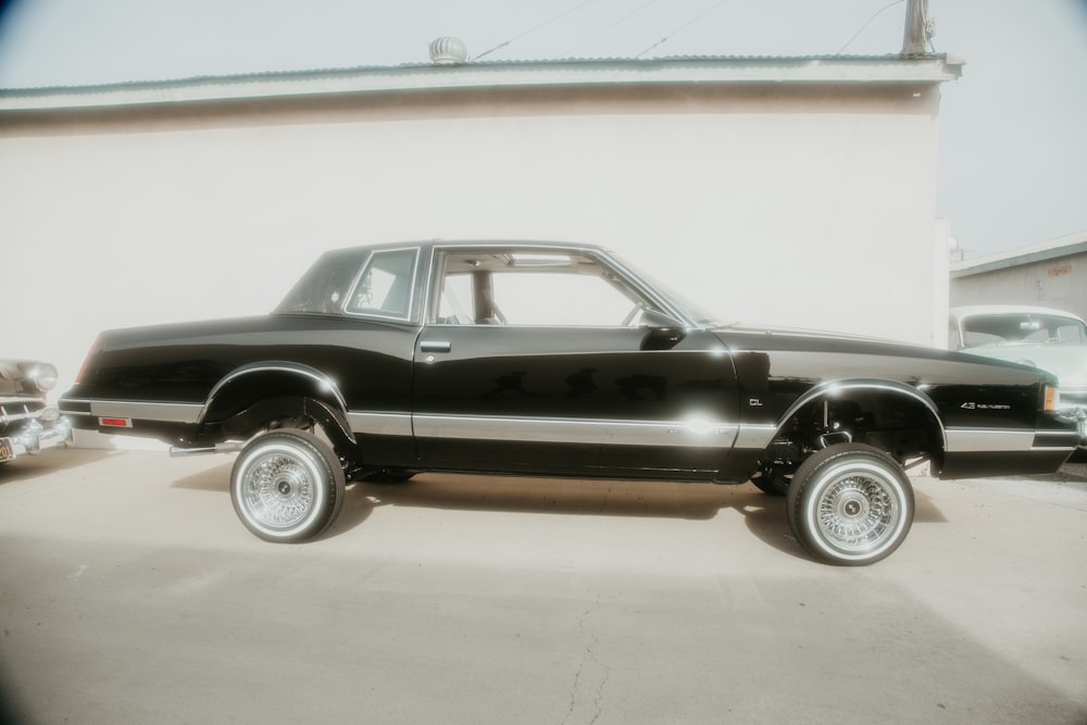 a black pickup truck parked in a parking lot