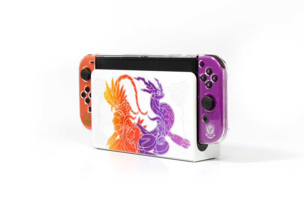 a nintendo wii game controller with a dragon on it