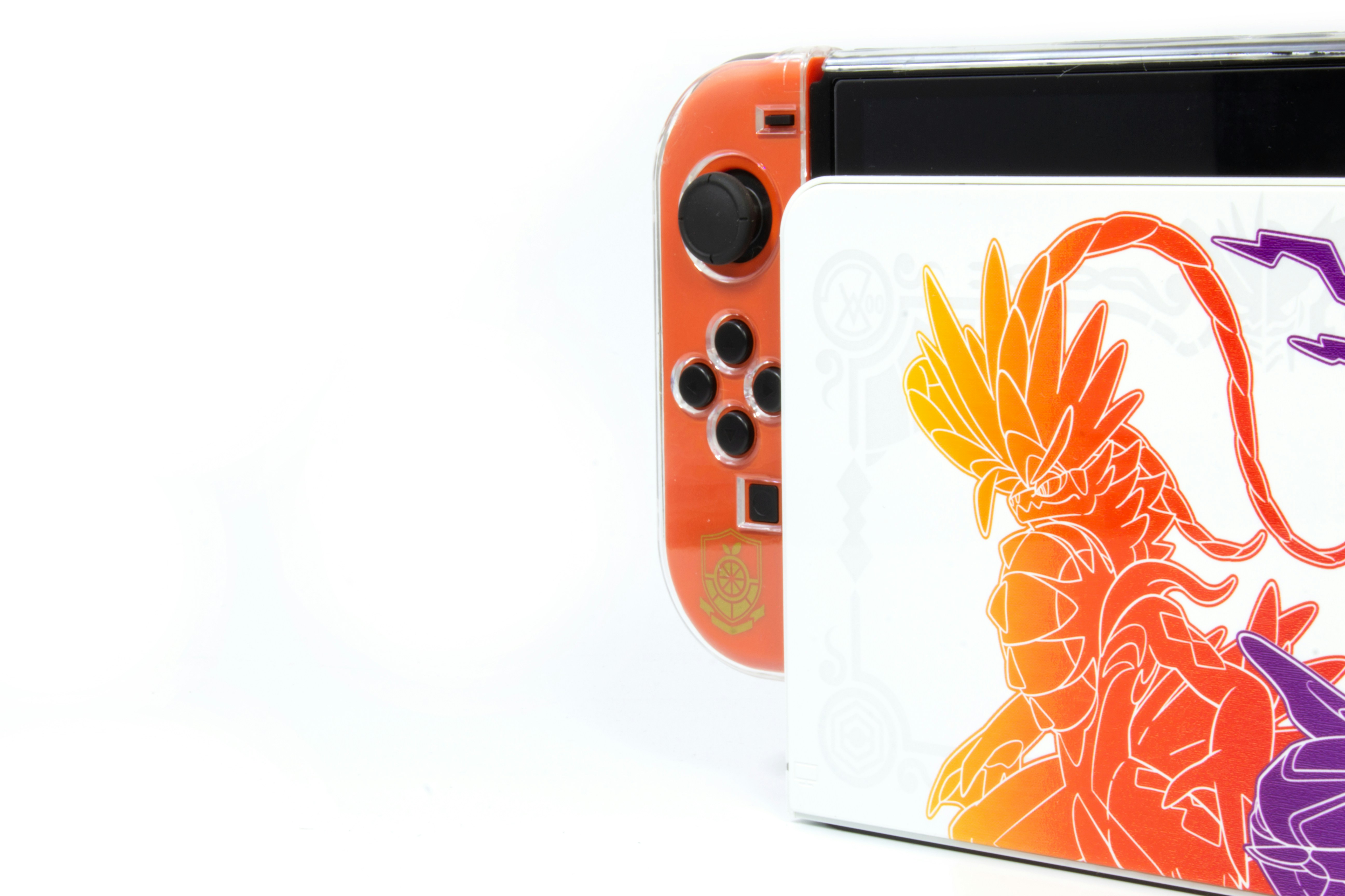 a nintendo wii game system with a picture of a dragon on it
