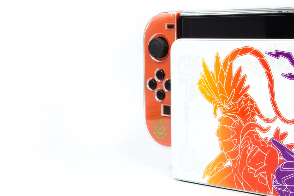 a nintendo wii game system with a picture of a dragon on it