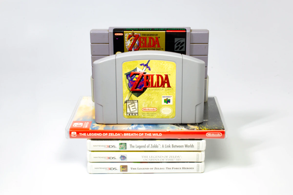 Zelda collection with Nintendo 3DS game cases stacked beneath classic Nintendo cartridges
