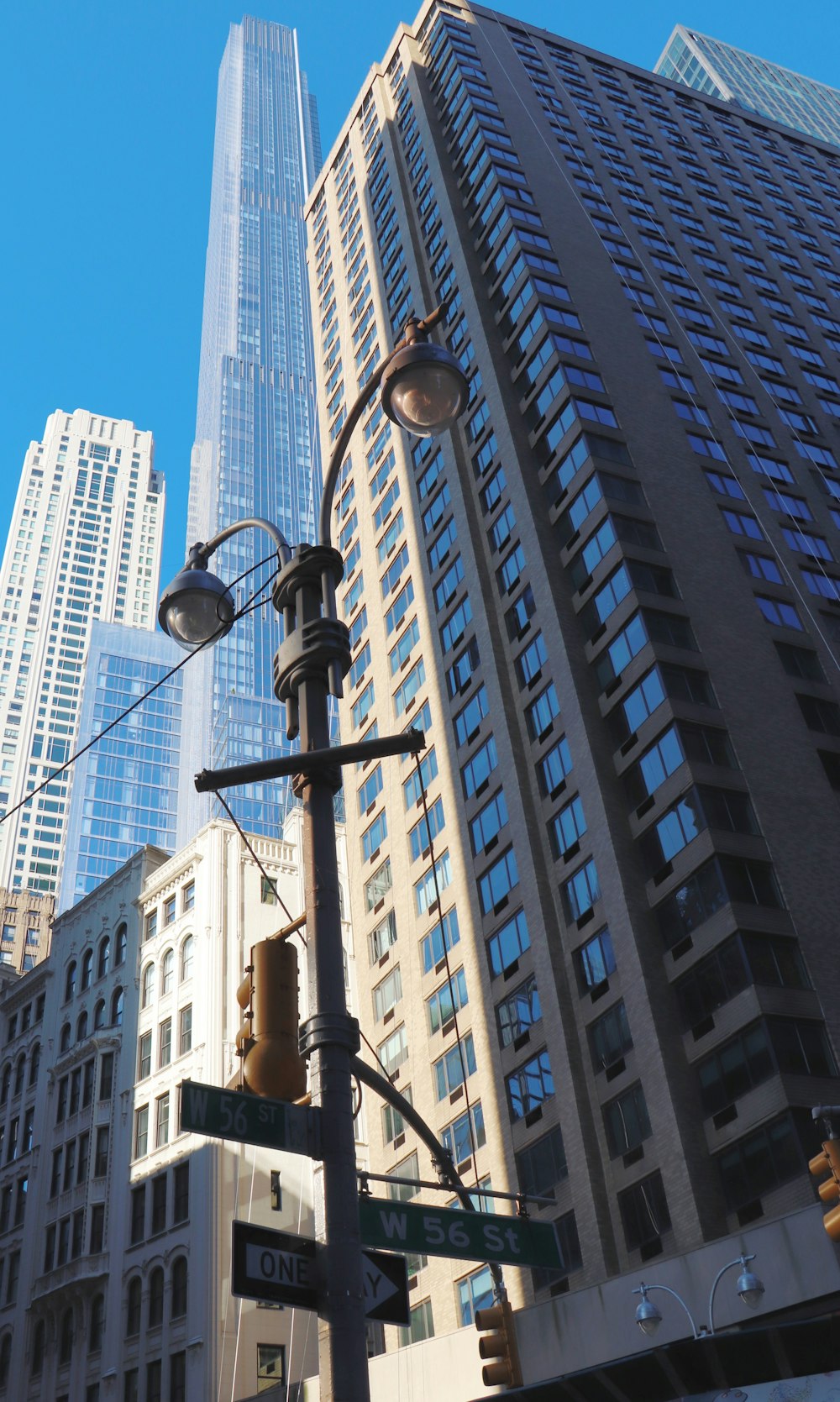 a street light in front of a tall building