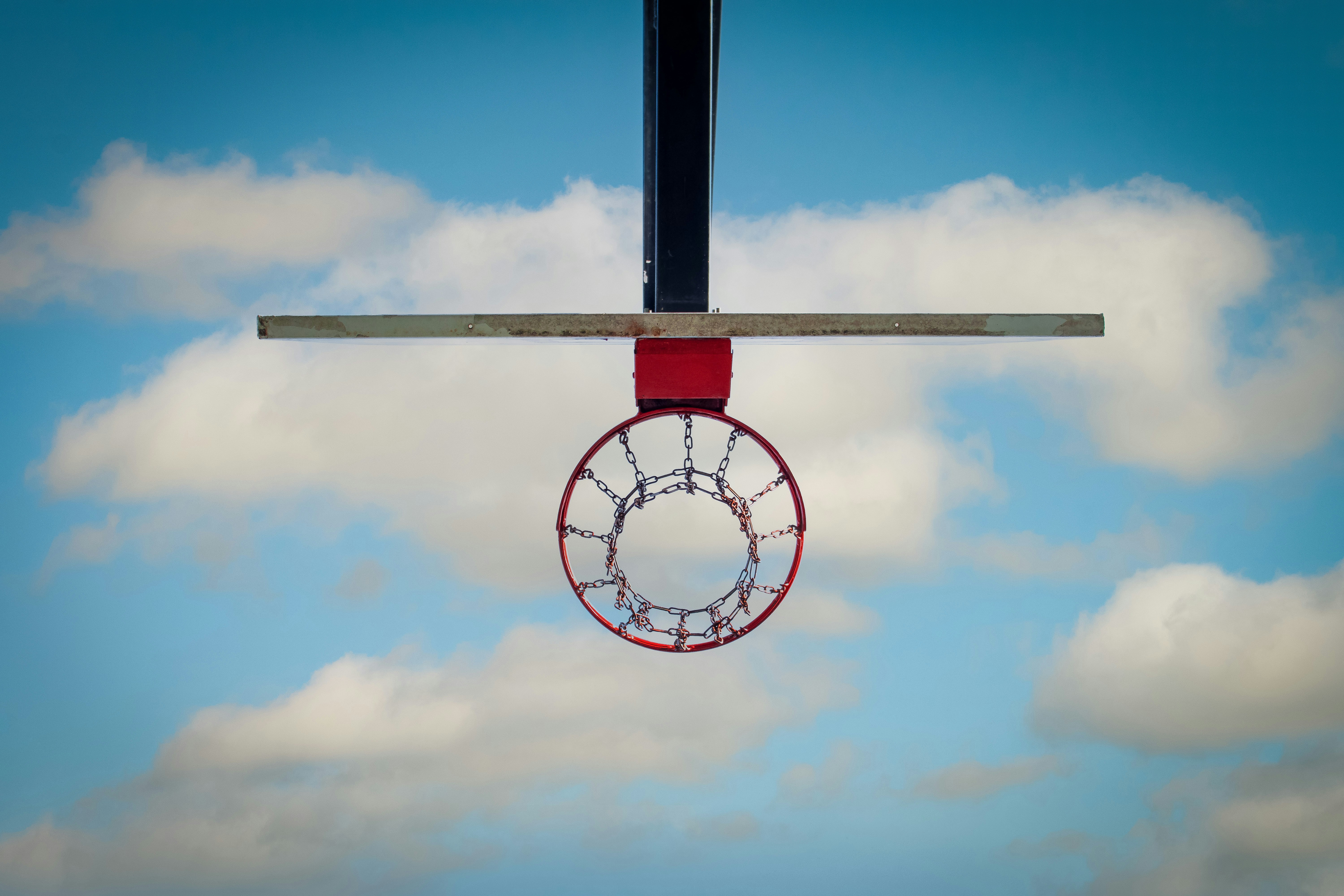 a basketball hoop hanging from the side of a basketball hoop