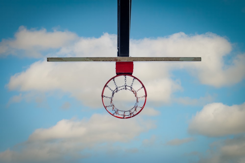 a basketball hoop hanging from the side of a basketball hoop