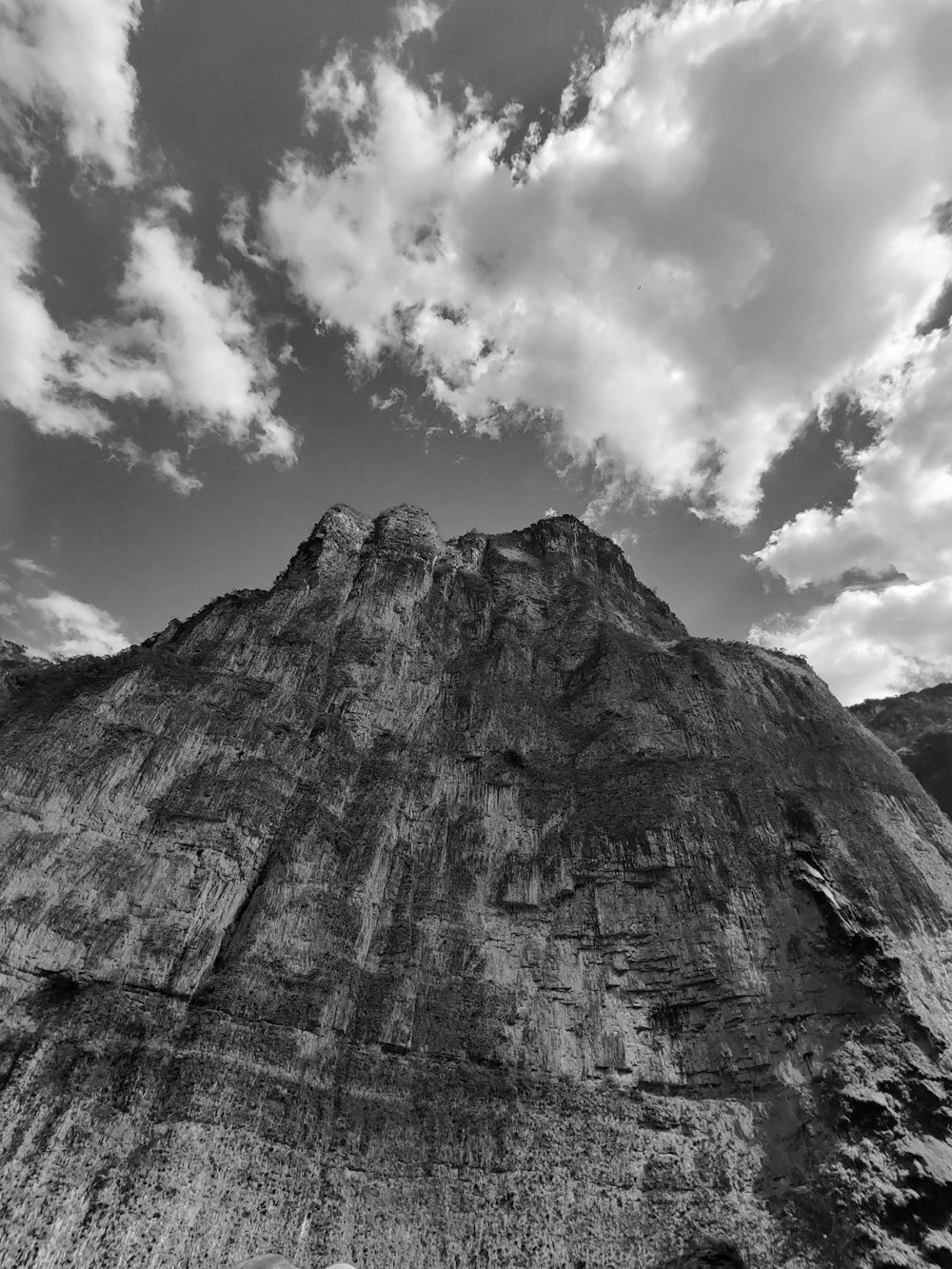 a black and white photo of a mountain