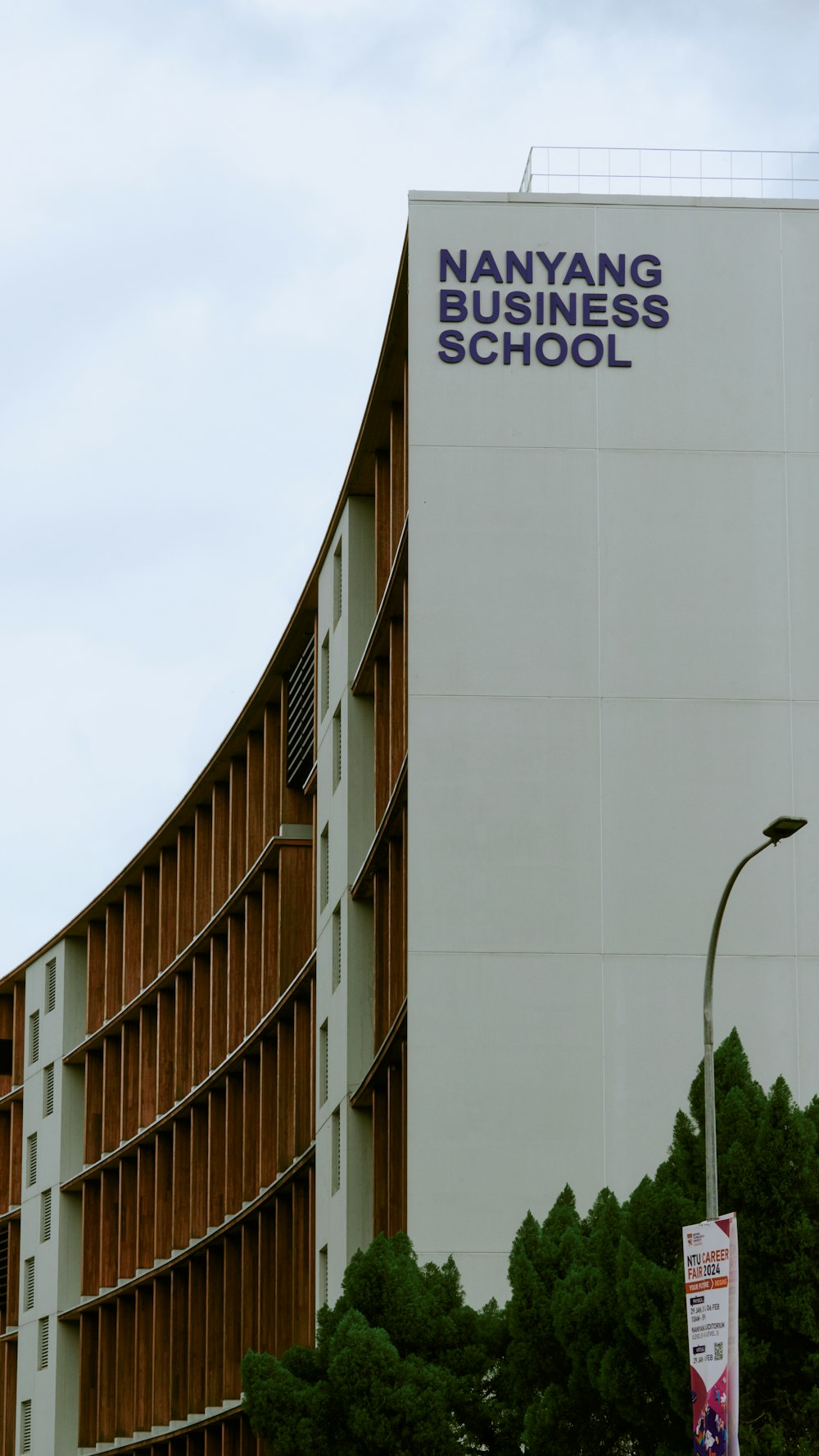 a tall building with a street light in front of it