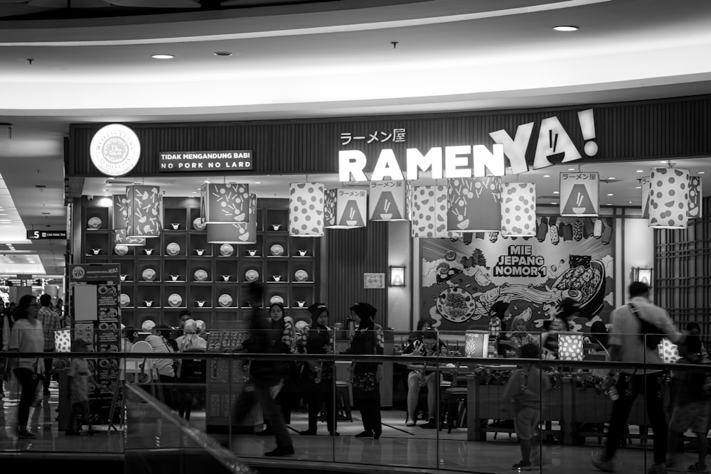 a black and white photo of a store front