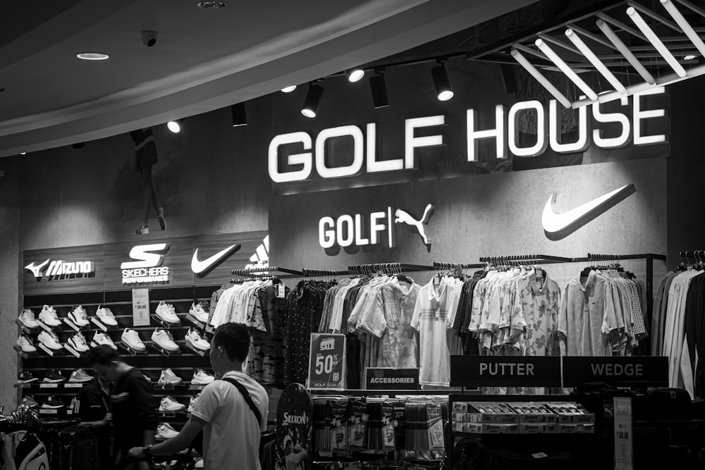 a black and white photo of a golf store