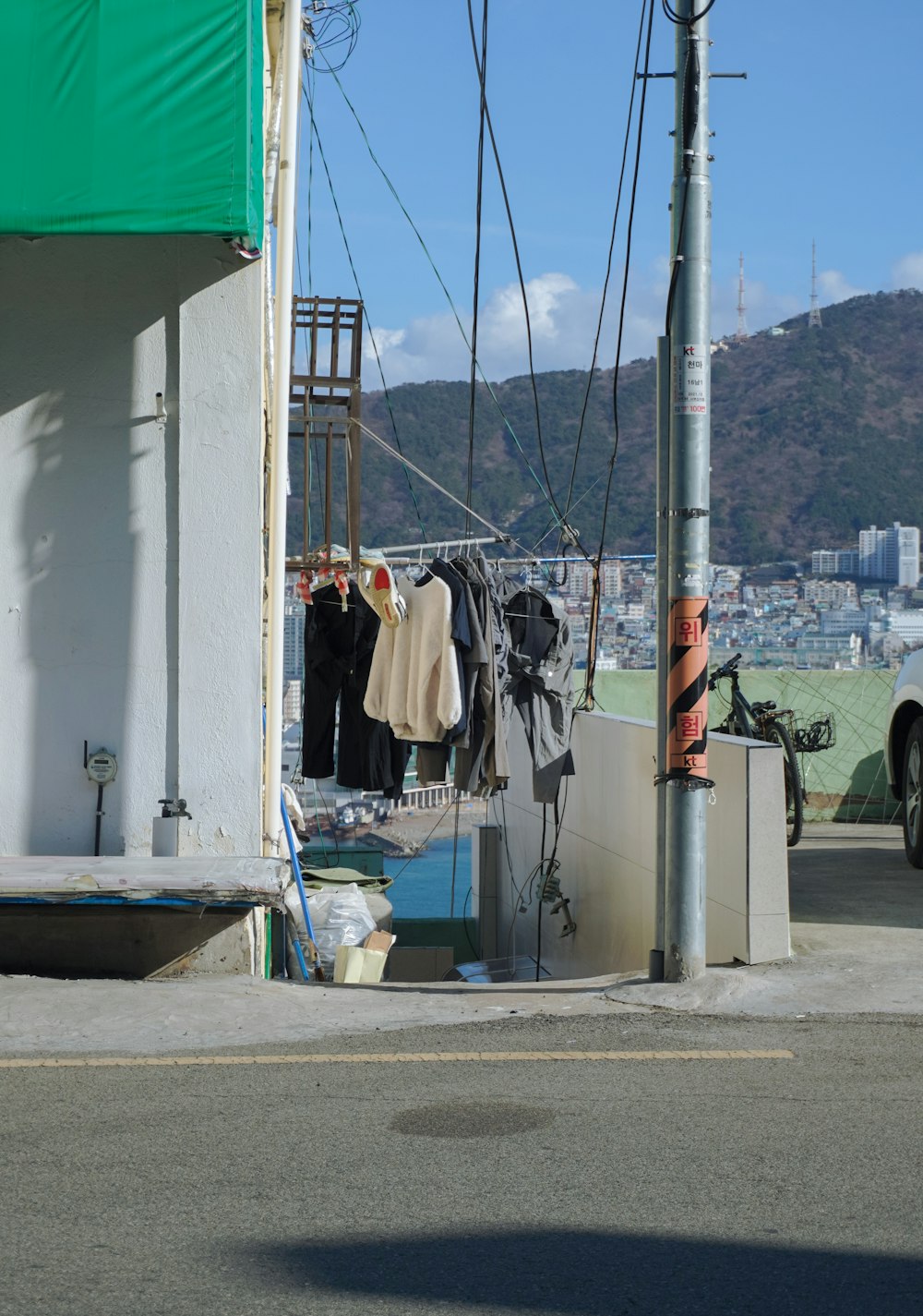 a street corner with clothes hanging on a clothes line