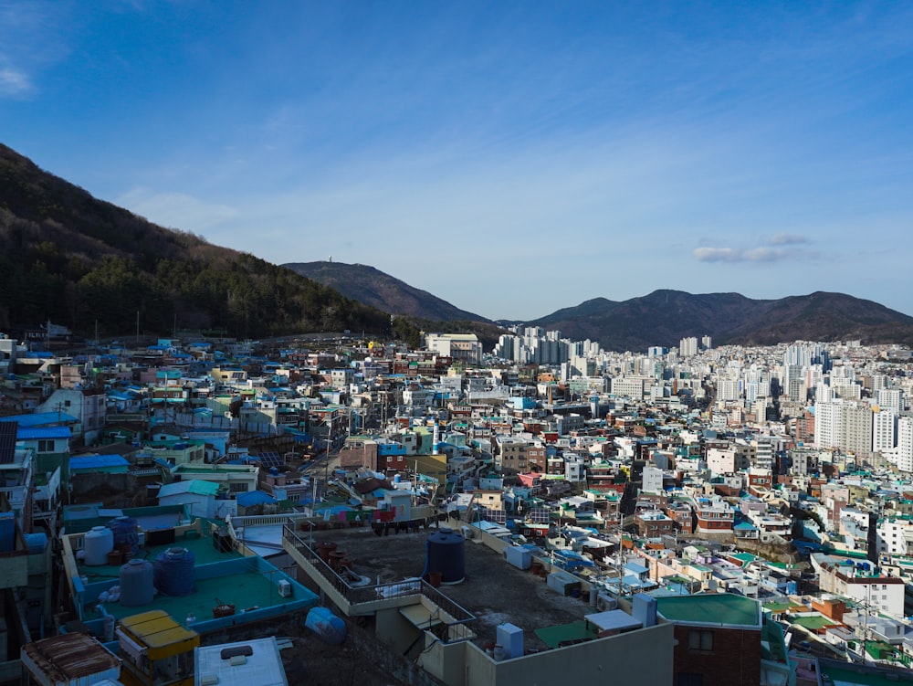 a view of a city with mountains in the background