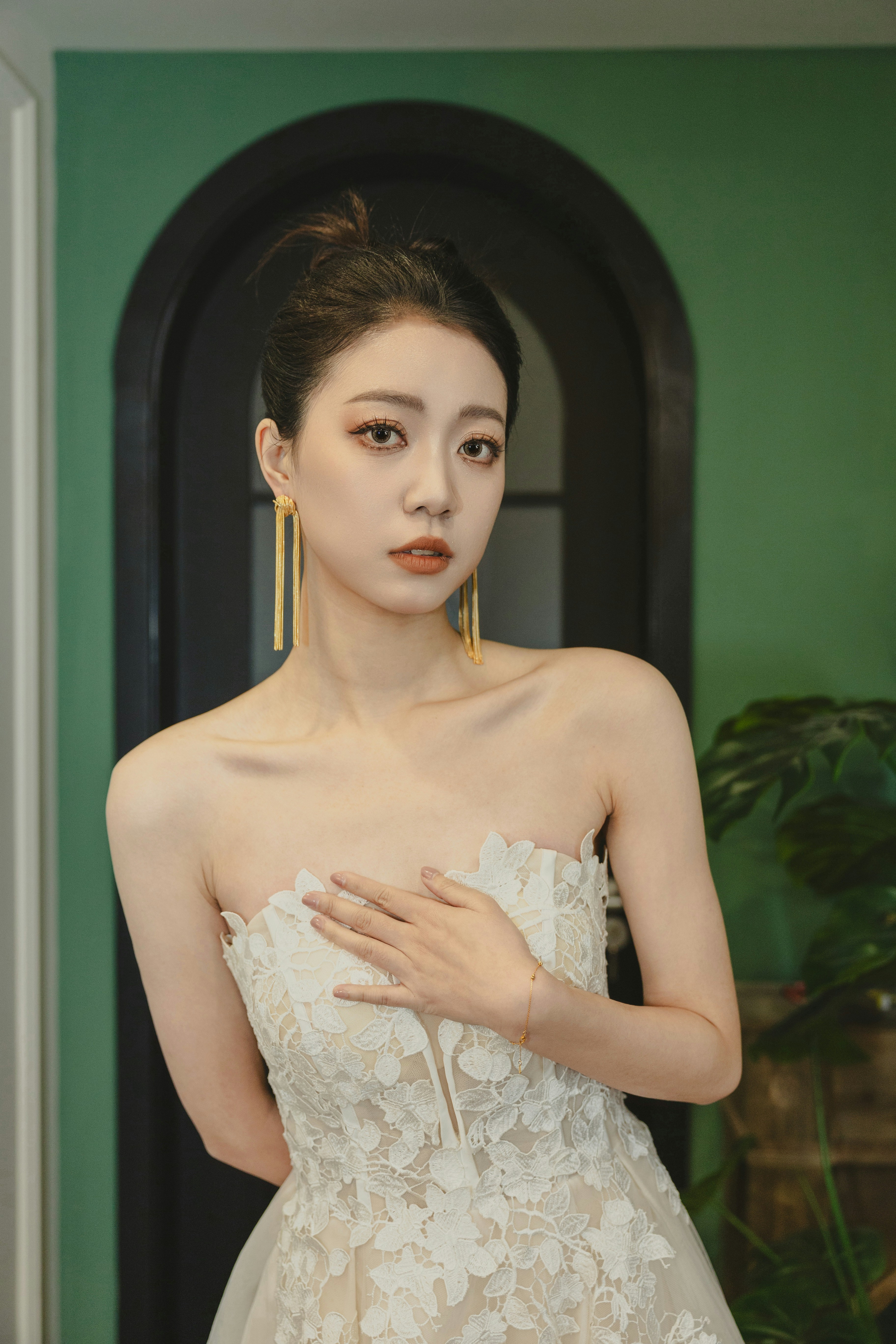 a woman in a wedding dress posing for a picture