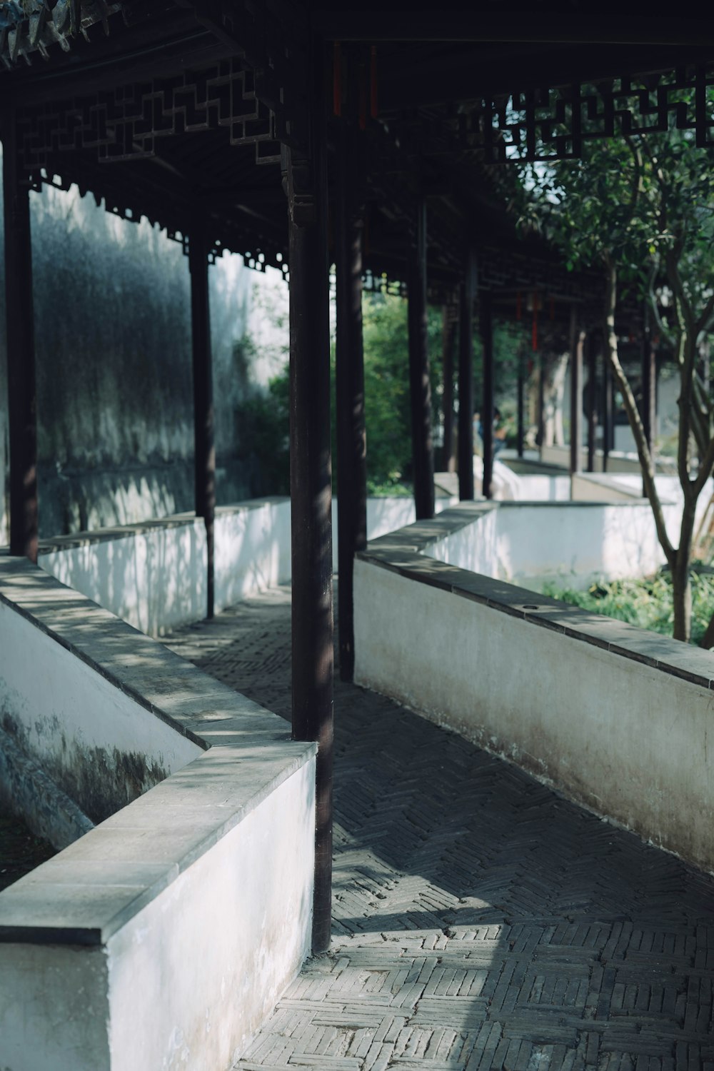 a man riding a skateboard down a brick walkway