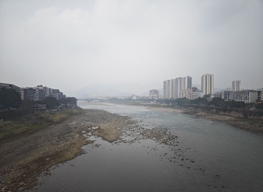 a body of water surrounded by tall buildings