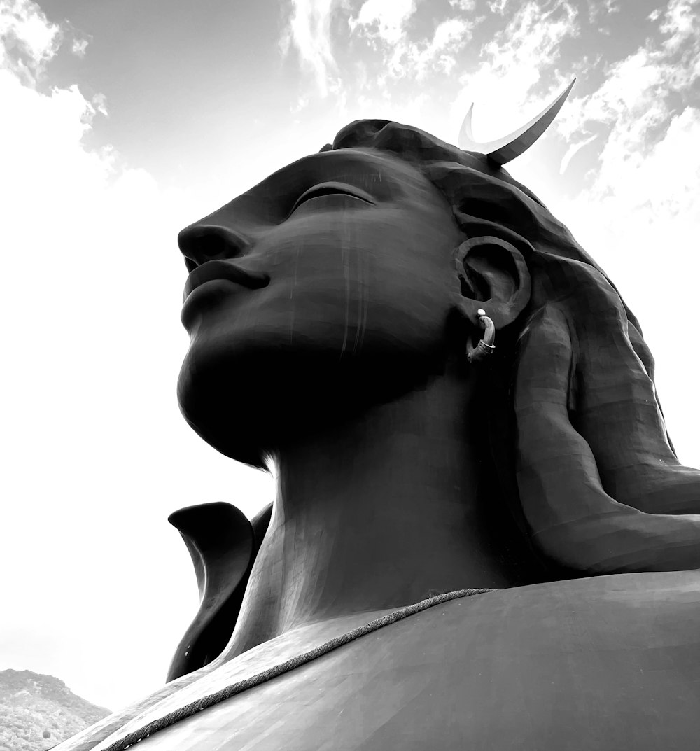 a black and white photo of a statue