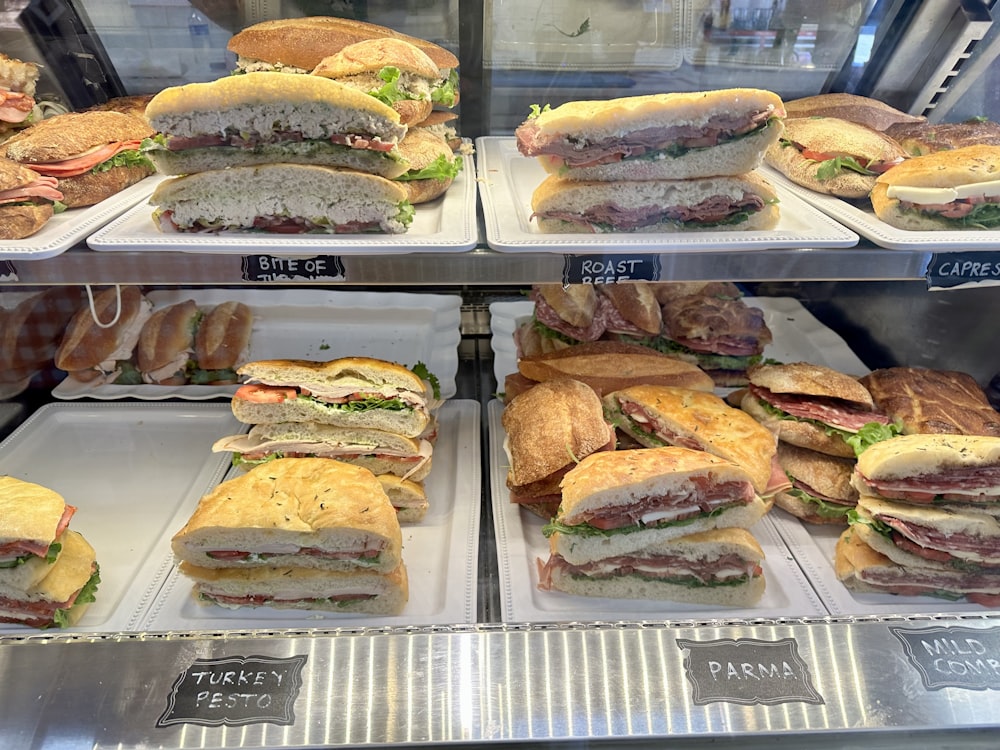 a display case filled with lots of sandwiches