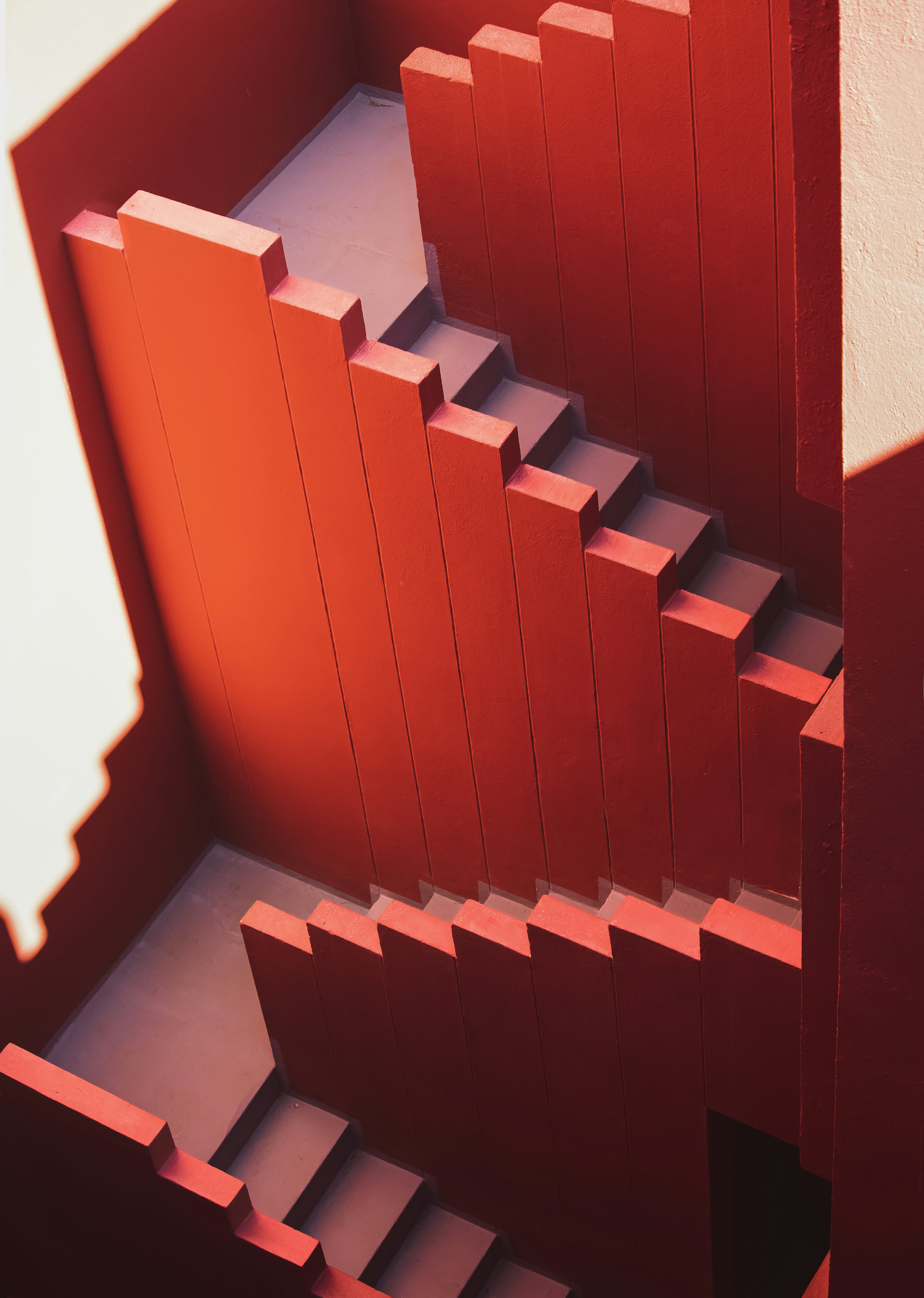 a close up of a staircase made out of red blocks