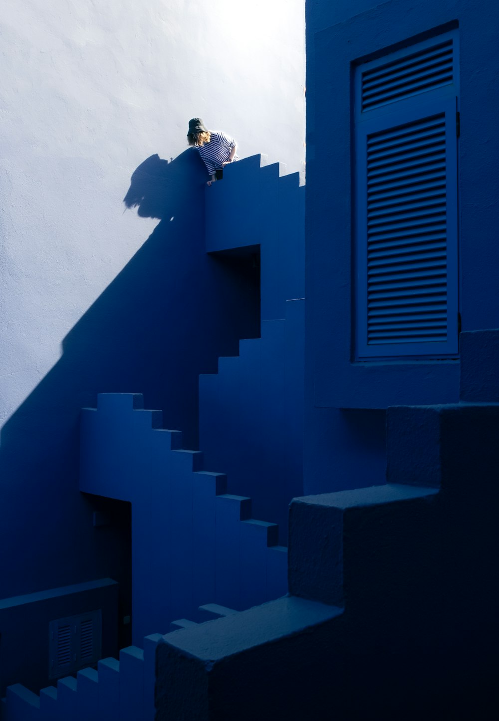 a man riding a skateboard down a set of stairs