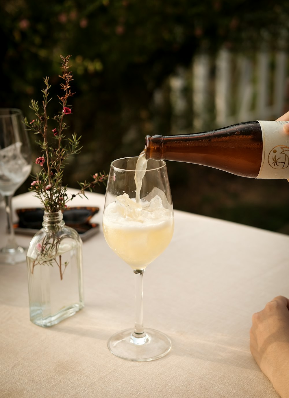 a bottle of wine being poured into a glass