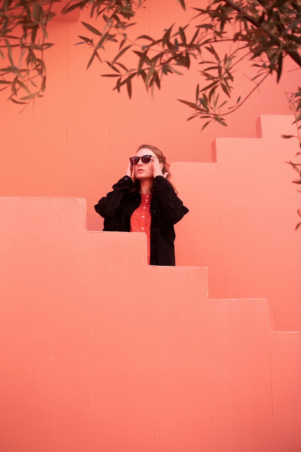 a woman looking through a pair of binoculars