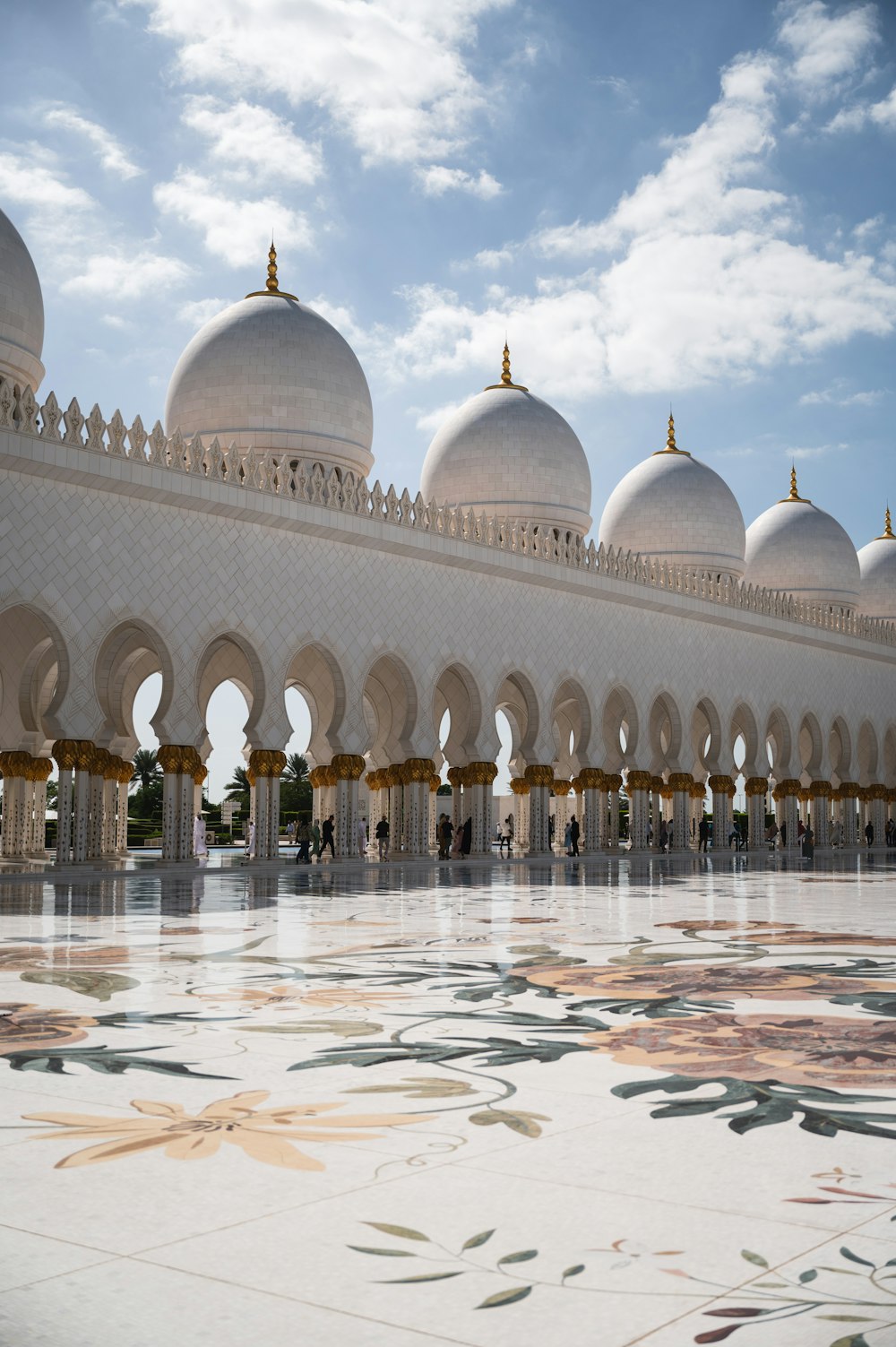 a large white building with many arches and domes