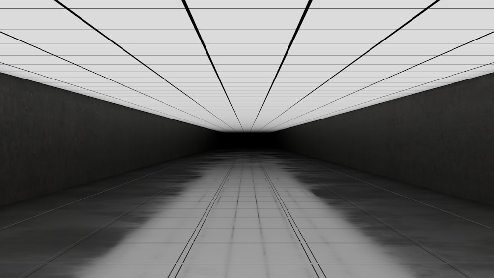 a black and white photo of a long hallway