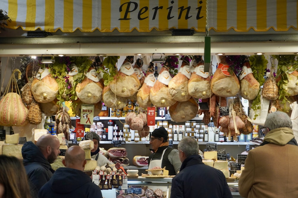 a group of people standing in front of a store