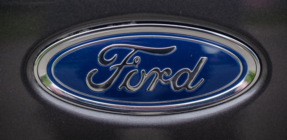 a close up of a ford emblem on a car