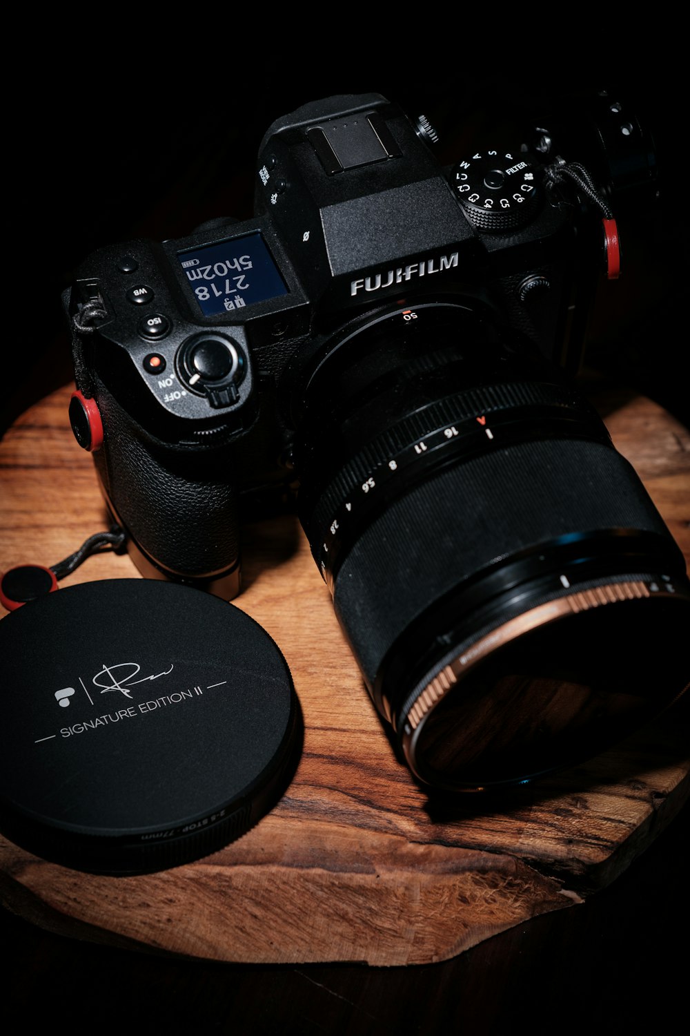 a camera sitting on top of a wooden table