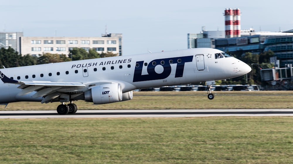 a large jetliner sitting on top of an airport runway