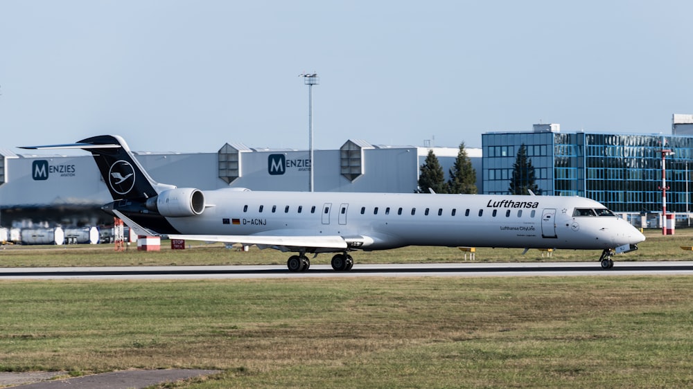 a large jetliner sitting on top of an airport runway