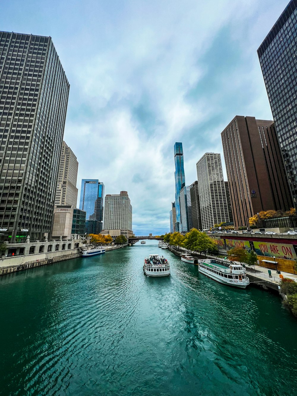 a river running through a city next to tall buildings