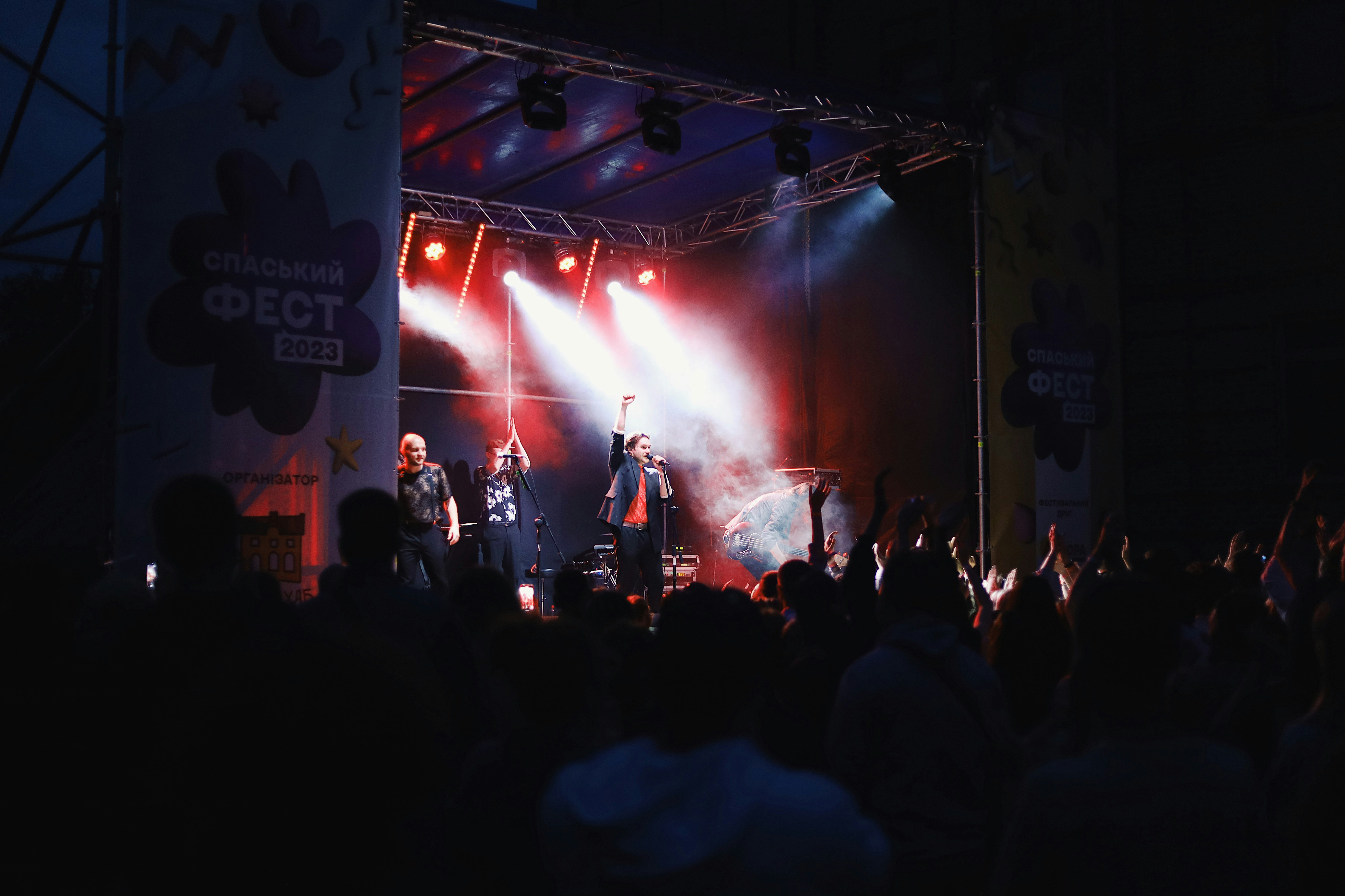 a group of people standing on top of a stage