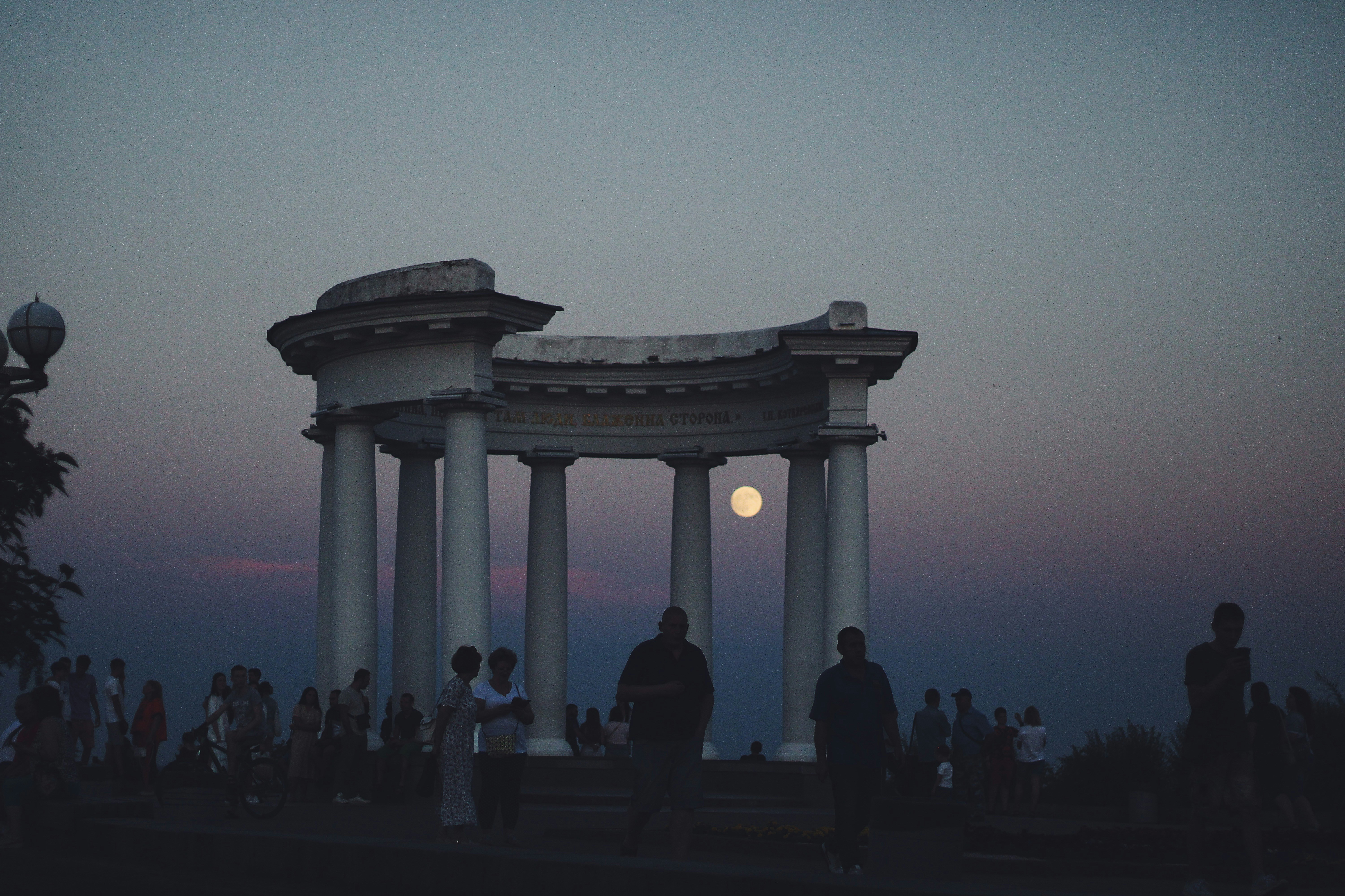 a group of people standing in front of a building