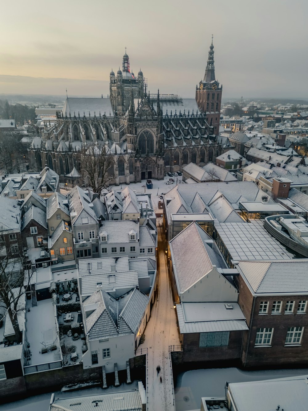an aerial view of a city in winter