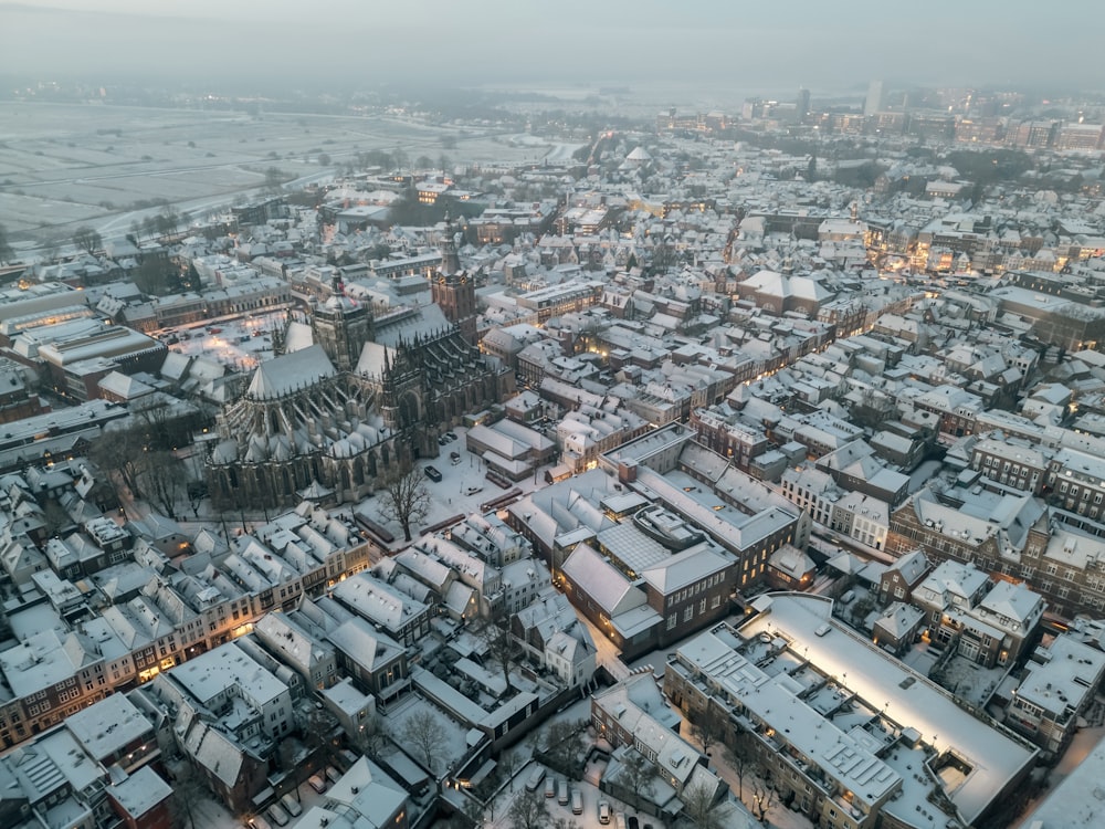 an aerial view of a city covered in snow