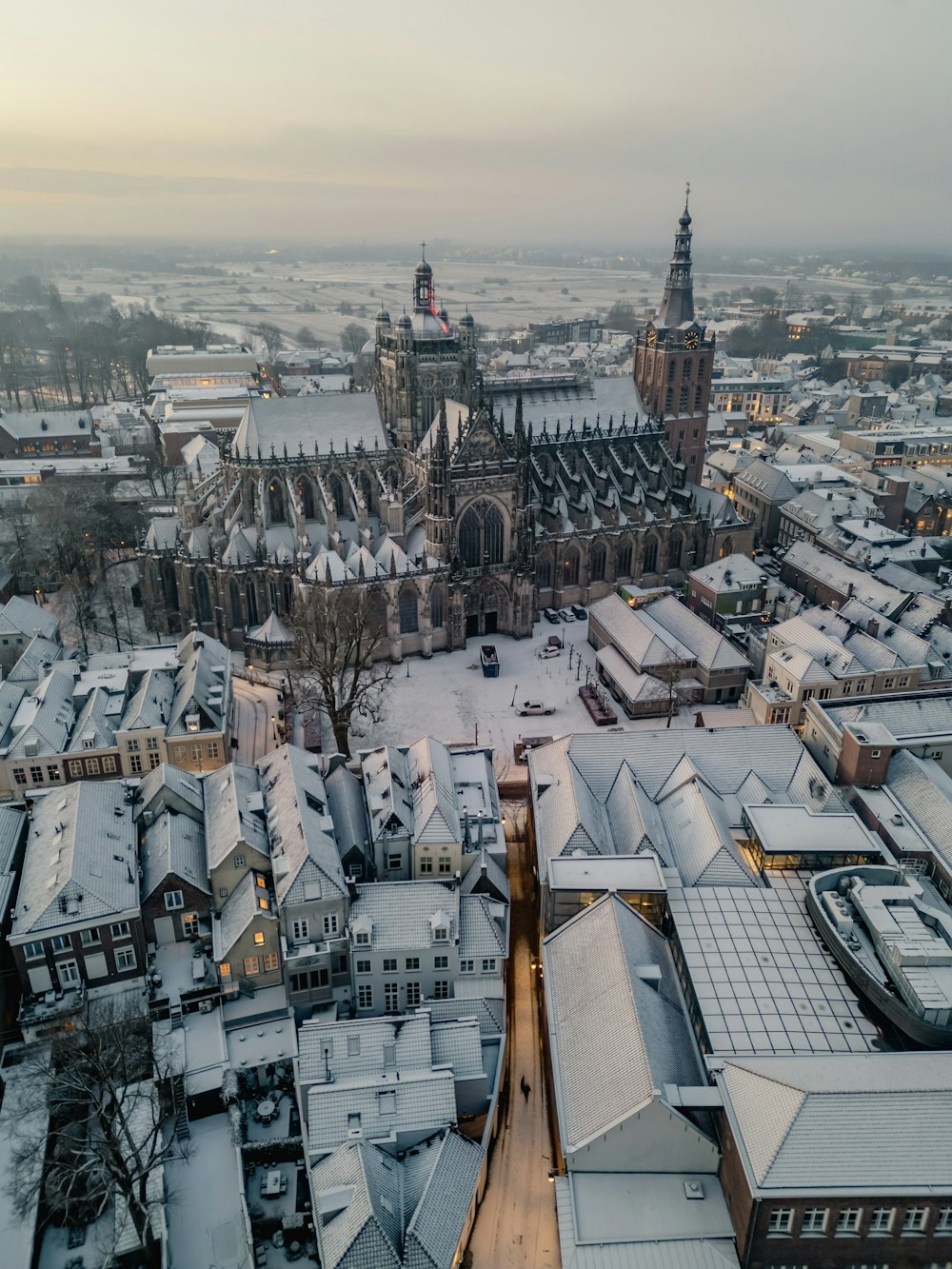 an aerial view of a city in winter