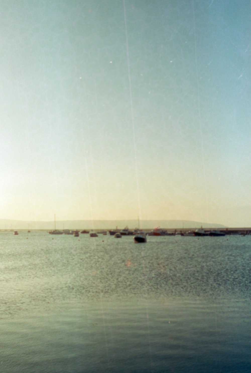 a body of water with boats in the distance