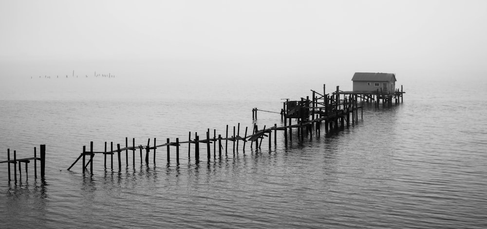 a long wooden pier sitting on top of a body of water