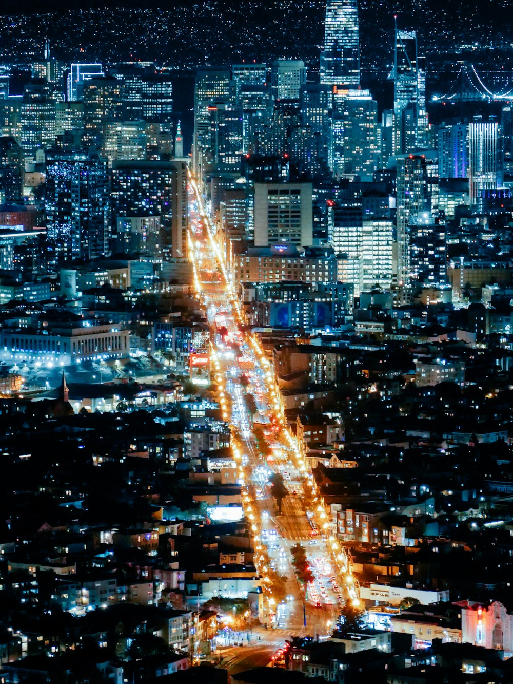 a city at night with lots of traffic