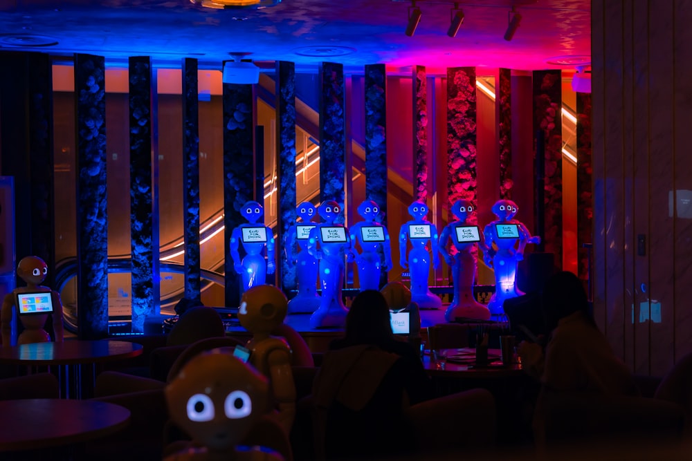 a group of people sitting in front of laptops