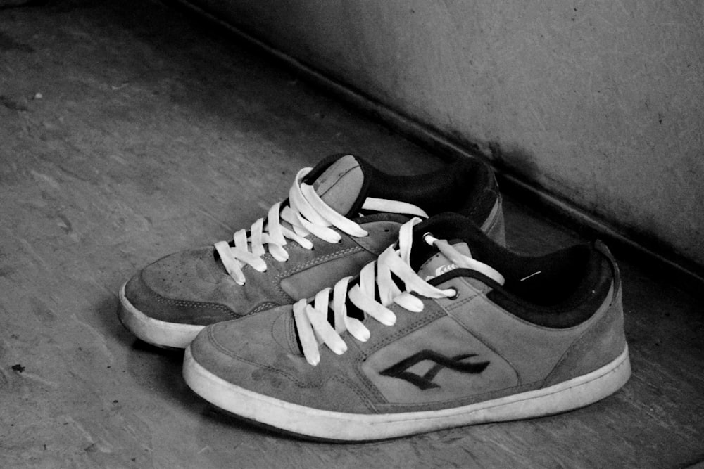 a black and white photo of a pair of shoes
